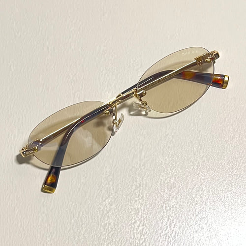 Armacao de grau Oval Virgínia Dourada Parafusada